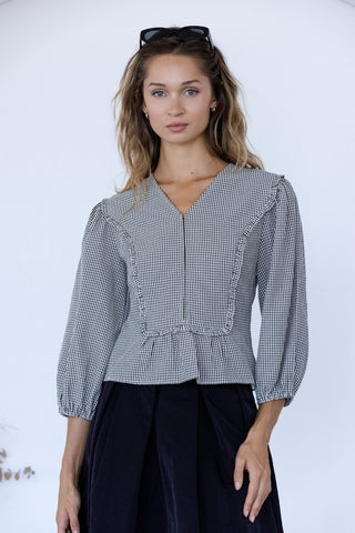 Navy Gingham Ruffle Peplum Blouse with V-neckline and puff sleeves