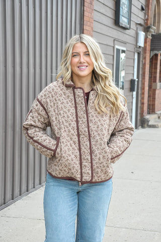 An allover floral print in a warm mix of colors gives it a soft, romantic look, while the diamond quilted design adds rich texture and visual depth that elevates it well beyond a basic jacket.