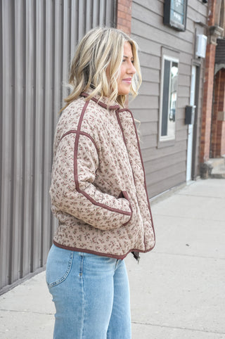 An allover floral print in a warm mix of colors gives it a soft, romantic look, while the diamond quilted design adds rich texture and visual depth that elevates it well beyond a basic jacket.