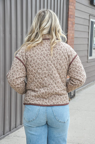 An allover floral print in a warm mix of colors gives it a soft, romantic look, while the diamond quilted design adds rich texture and visual depth that elevates it well beyond a basic jacket.