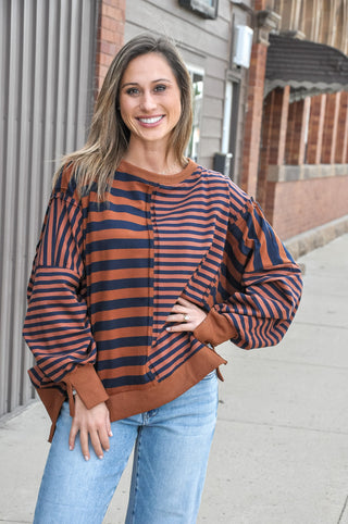 Layer up in this easy-going mixed stripe pullover sweatshirt — a cozy essential with contrast panel detailing and ribbed trim that gives it that polished, put-together look without any extra effort.