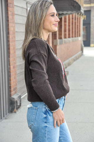 The relaxed fit, drop-shoulder sleeves, and ribbed trim keep it comfortable while adding just the right amount of personality to fall denim or printed trousers.
