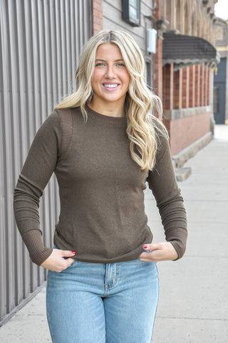 The classic crew neck is finished with a subtle frayed band, and the extended fitted ribbed cuffs add even more tactile interest to the long sleeve silhouette.