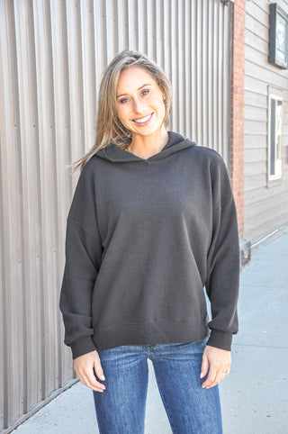 Available in black, blue, mauve, or denim, this ultra-soft hoodie features a relaxed silhouette that makes it an easy go-to piece for casual days, lounging, or layering through every season.