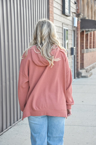 Available in black, blue, mauve, or denim, this ultra-soft hoodie features a relaxed silhouette that makes it an easy go-to piece for casual days, lounging, or layering through every season.