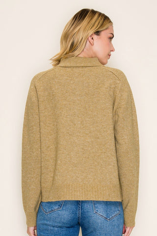 This collared button-down cardigan features a polished spread collar, side pockets, and a clean button-front closure that gives it a refined, put-together look — all while staying cozy and comfortable in a soft poly-wool blend.