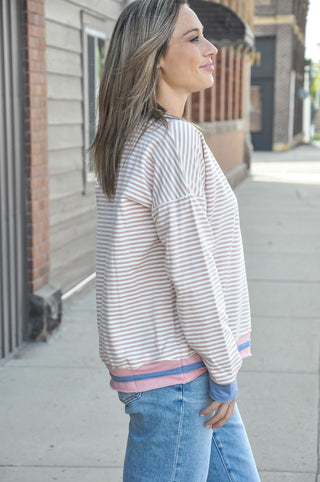  This long sleeve striped sweatshirt is crafted in a soft 95% cotton blend that feels as good as it looks, with thoughtful color-contrasted detailing at the neckline, cuffs, and raw-cut hem that gives it that effortlessly cool, lived-in feel. 