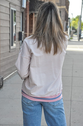 This long sleeve striped sweatshirt is crafted in a soft 95% cotton blend that feels as good as it looks, with thoughtful color-contrasted detailing at the neckline, cuffs, and raw-cut hem that gives it that effortlessly cool, lived-in feel. 