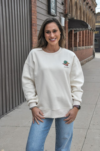 This cream graphic sweatshirt features a bold "Quack Off" design with a nod to duck hunting culture — equal parts humor and laid-back outdoor style. Cozy fabric and a relaxed fit make it the perfect off-season staple for anyone who lives for early mornings in the blind.