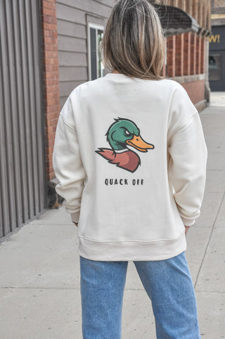This cream graphic sweatshirt features a bold "Quack Off" design with a nod to duck hunting culture — equal parts humor and laid-back outdoor style. Cozy fabric and a relaxed fit make it the perfect off-season staple for anyone who lives for early mornings in the blind.