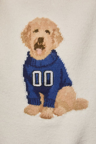 An adorable dog in a sporty sweater adds spirited charm, while the relaxed oversized fit keeps it easy to throw on and go.