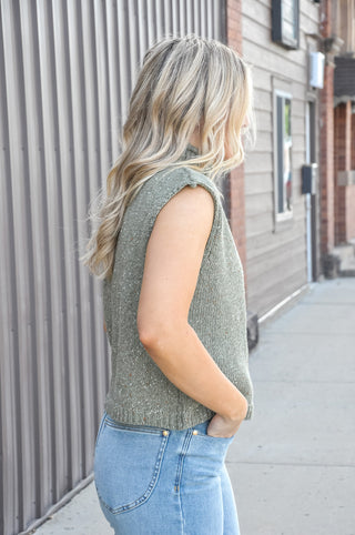 Sleeveless mock neck sweater in olive.