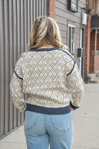 An allover diamond pattern blooms with delicate floral accents, while the relaxed silhouette, ribbed crew neck, cuffs, and hem keep the feel easy and cozy.