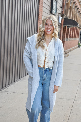 Hooded design for added warmth and casual style.  Open-front silhouette — easy to layer over any outfit.
