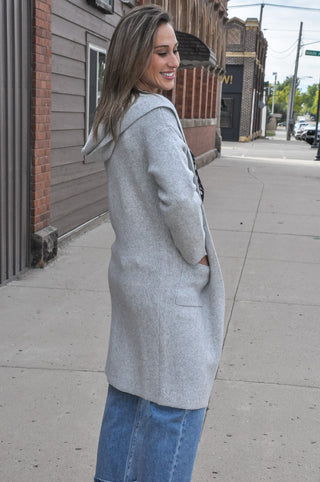 Hooded design for added warmth and casual style.  Open-front silhouette — easy to layer over any outfit.