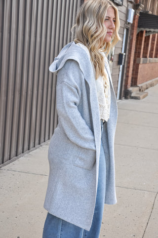 Hooded design for added warmth and casual style.  Open-front silhouette — easy to layer over any outfit.