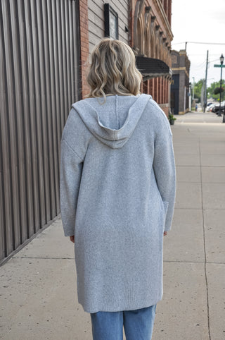 Hooded design for added warmth and casual style.  Open-front silhouette — easy to layer over any outfit.
