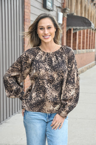 The classic round neck and raglan long sleeves create an easy, polished shape that looks right with denim, trousers, or layered under a vest.