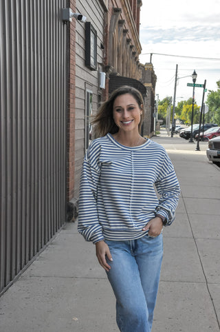 The loose fit and crew neckline keep it relaxed, while the center cut edge detail adds a subtle, elevated touch that sets it apart from your basic sweatshirt.