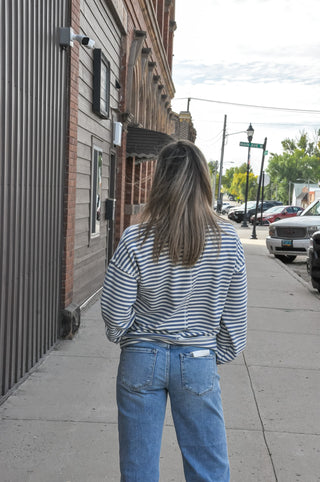 The loose fit and crew neckline keep it relaxed, while the center cut edge detail adds a subtle, elevated touch that sets it apart from your basic sweatshirt.