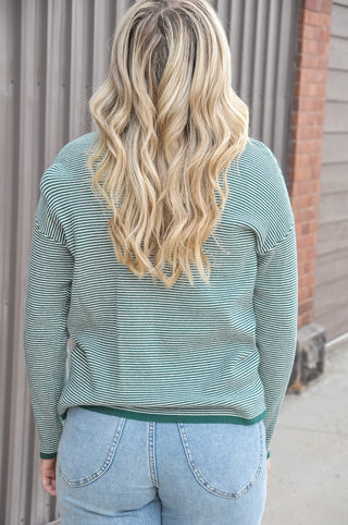  This mini waffle textured pullover in a rich forest green features a subtle pinstripe running throughout the waffle knit that adds just the right amount of dimension and visual interest. 