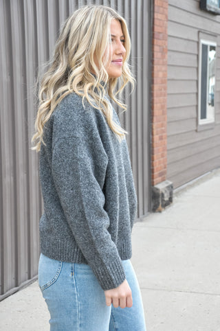 The Mockneck Long Sleeve Sweater in Burgundy or Charcoal is a cozy, polished staple with an effortlessly elevated feel. Designed with a soft knit texture, this sweater features a classic mock neckline that adds warmth without feeling bulky.