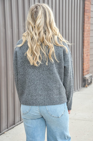 The Mockneck Long Sleeve Sweater in Burgundy or Charcoal is a cozy, polished staple with an effortlessly elevated feel. Designed with a soft knit texture, this sweater features a classic mock neckline that adds warmth without feeling bulky.