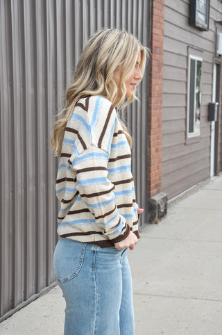 Two looks, one cardigan. This multi-stripe knit cardigan features a reversible design that gives you twice the styling options — wear it as a classic button-front cardigan or flip it for a crew neck pullover look, depending on your mood. 