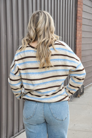 Two looks, one cardigan. This multi-stripe knit cardigan features a reversible design that gives you twice the styling options — wear it as a classic button-front cardigan or flip it for a crew neck pullover look, depending on your mood. 