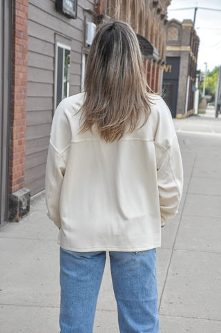 The classic crew neckline and long sleeves keep the silhouette clean and timeless, while the relaxed, oversized fit adds a laid-back, modern ease that works beautifully for both casual and elevated looks.