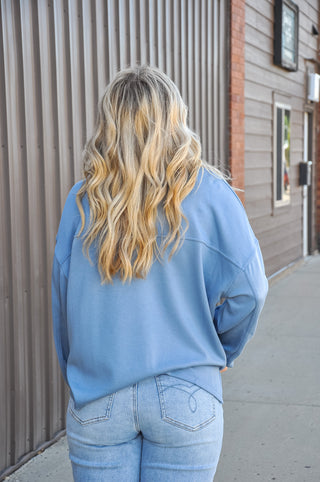 The classic crew neckline and long sleeves keep the silhouette clean and timeless, while the relaxed, oversized fit adds a laid-back, modern ease that works beautifully for both casual and elevated looks.
