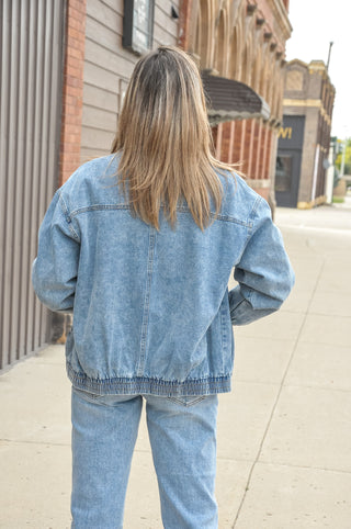 A zip-front design gives classic denim a little modern edge, while the relaxed shape makes room for easy layering.