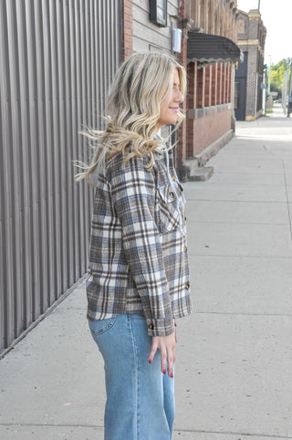  This brushed plaid button-down layers effortlessly over any look, with a terry drawstring hoodie and flap pockets that make it as functional as it is stylish. 