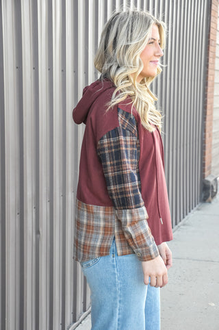 This micro brushed drawstring hoodie top is the perfect mix of cozy and cool, featuring plaid-inserted sleeves that give it that effortless mix-media charm.