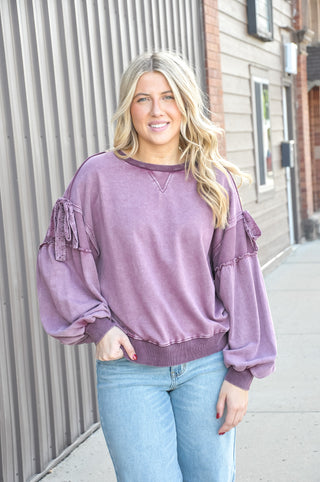 Mineral wash finish in rich plum, crew neckline with oversized fit.