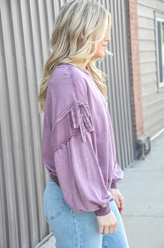 Mineral wash finish in rich plum, crew neckline with oversized fit.