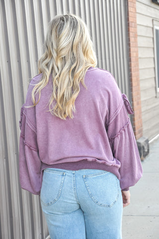 Mineral wash finish in rich plum, crew neckline with oversized fit.