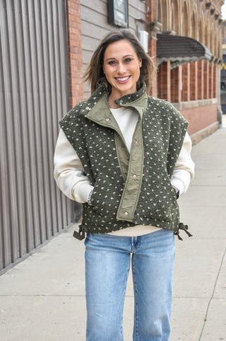  The textured sherpa fabric adds warmth and visual interest, while the playful polka dot pattern keeps it fun and fashion-forward. 
