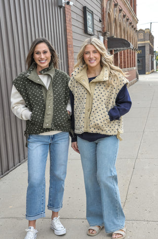  The textured sherpa fabric adds warmth and visual interest, while the playful polka dot pattern keeps it fun and fashion-forward. 