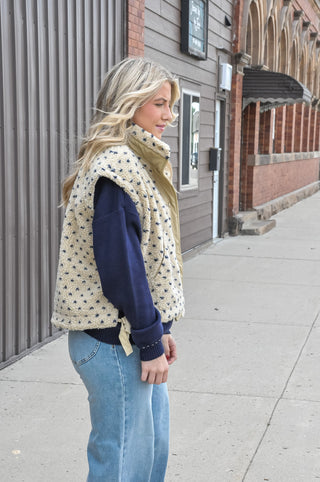  The textured sherpa fabric adds warmth and visual interest, while the playful polka dot pattern keeps it fun and fashion-forward. 