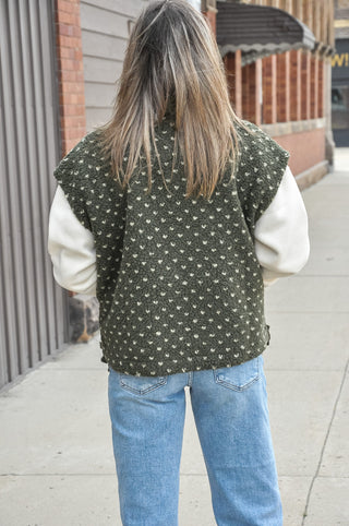  The textured sherpa fabric adds warmth and visual interest, while the playful polka dot pattern keeps it fun and fashion-forward. 
