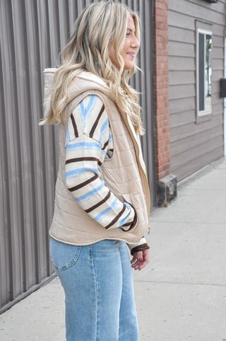 The full zip-up front makes layering effortless, while the attached hood adds an extra touch of warmth and laid-back style.