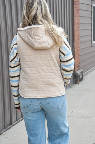 The full zip-up front makes layering effortless, while the attached hood adds an extra touch of warmth and laid-back style.