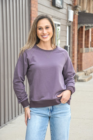 This relaxed fit crew neck sweatshirt in a rich, moody purple is exactly that — soft, easy, and effortlessly put-together. 