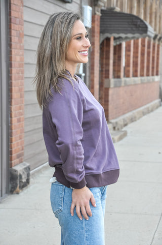 This relaxed fit crew neck sweatshirt in a rich, moody purple is exactly that — soft, easy, and effortlessly put-together. 