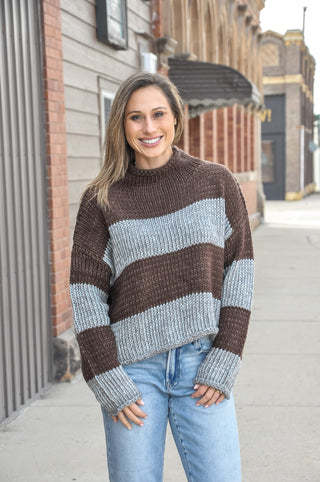 This staple stripe sweater features an airy knit with a rolled neckline and dropped shoulders for that effortless laidback look. 
