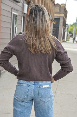 This split neck mini waffle sweater in a rich chocolate hue is the kind of everyday essential that makes getting dressed easy.