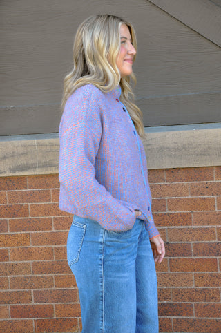 Bright, cheerful, and full of personality, the Stand Color Sweater Cardigan with Colorful Buttons is the perfect way to add a playful touch to your wardrobe. 