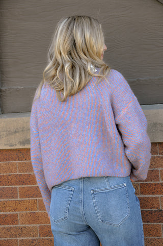 Bright, cheerful, and full of personality, the Stand Color Sweater Cardigan with Colorful Buttons is the perfect way to add a playful touch to your wardrobe. 