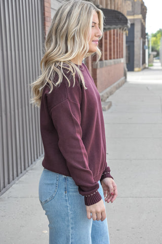 This stitch detailed solid sweater in a rich navy or beautiful plum, is one of those wardrobe-building pieces you'll reach for all season long.